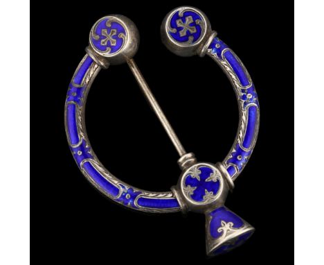 A 19th century Scottish Celtic blue enamel penannular brooch, unmarked silver settings with allover engraved decoration, ring