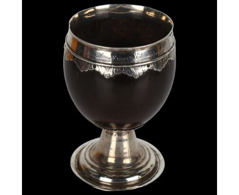 A 17th/18th century silver-mounted coconut cup, with later engraved inscription dated 1875, height 13cmNo damage or repair, p