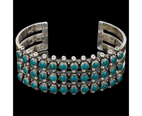 A Native American Navajo sterling silver and turquoise cuff bracelet, band width 23.5mm, internal circumference 16cm, 42.4gNo