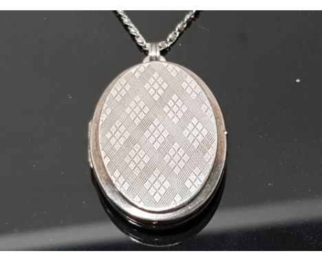 LARGE ENGINE TURNED LOCKET AND CHAIN WITH TARTAN DESIGN TO ONE SIDE