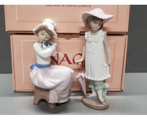 2 NAO BY LLADRO FIGURES 1049 A BIG HUG AND 1126 APRIL SHOWERS BOTH WITH ORIGINAL BOXES