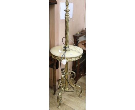 An early 20th century brass and onyx standard lamp table, H.135cm