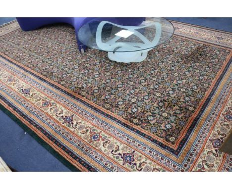 A Persian green ground carpet, 475 x 305cm