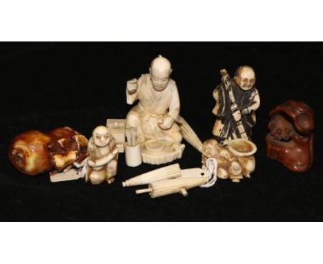 Four Japanese ivory netsuke and a vegetable ivory snuff bottle