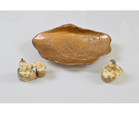 Two early 20th Century bone netsuke, modelled as two figures seated with baskets, with engraved and incised decoration, 4cm x