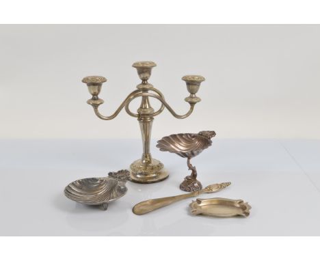 A hallmarked silver ashtray, 52g together with a quantity of silver plated items including a candelabra, dishes in the form o