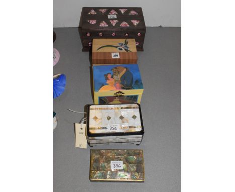 Four music boxes, one with mother-of-pearl decoration; and another trinket box.