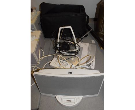 A Bose digital music sound system, with remote, manual, case and TV booster aerial.