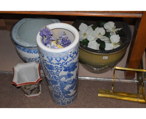 A modern Chinese blue and white stick stand; a similar jardiniere with later glass top; a square-shaped vase with bird decora