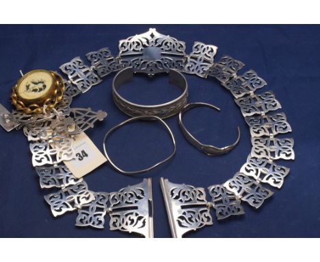 A silver bangle by Reed & Barton, stamped 'Sterling'; two silver bangles, one stamped '800 SMS', the other stamped '925'; a s