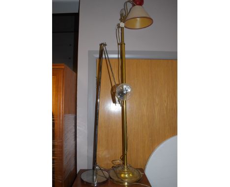 A 20th Century adjustable brass standard lamp; and a chrome standard lamp with glass shade, by Habitat. (2)