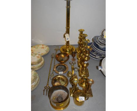 Brassware, to include: a large ecclesiastical candlestick; two pairs of candlesticks; toasting forks; a WWI shell dated 1917;