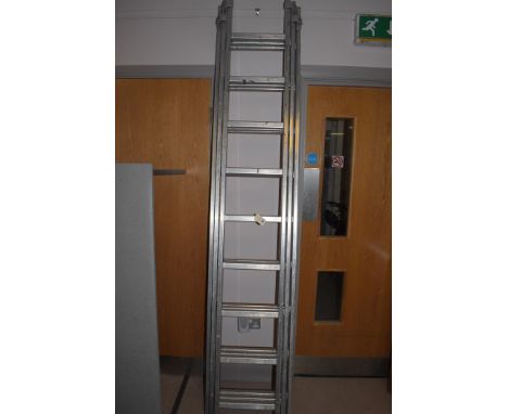 A three section extending aluminium ladder, by Youngman, 350cms.