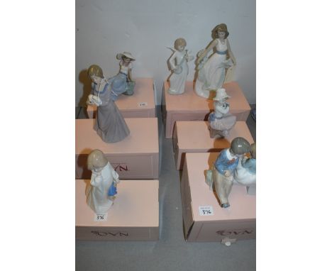 Nao figures, to include: girl with rabbit; boy and girl seated on a bench; girl with doll; and others, six in original boxes.