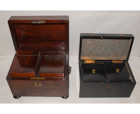 A Victorian mahogany tea caddy, the top opening to reveal lift-out compartments, raised on bun feet; and another ebonised tea