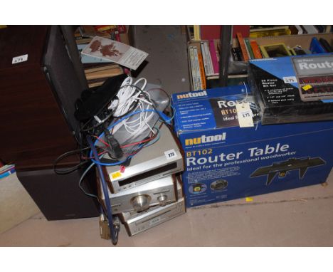 A Nutool no.BT102 router table; together with Powerbase twenty-piece router bit-set, both in original boxes; together with a 