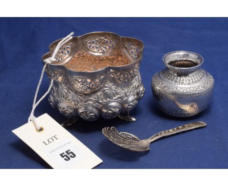 A white metal bowl, probably Indian; together with a white metal miniature pot and a filigree caddy spoon.