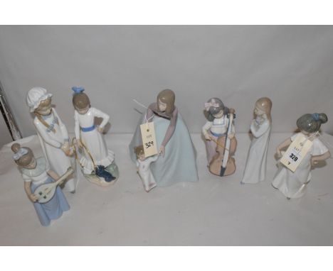 Nao figures, to include: a mother and child; a girl playing the guitar; a girl playing a cello; and others, boxed.  (7)