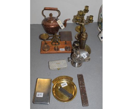 A 19th Century copper kettle; a pair of brass scales; a pair of brass candlesticks in the form of male figures; a silver-plat