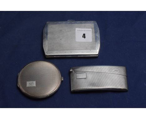 A George V silver card case, by Walker & Hall, Sheffield 1929, with engine turned decoration and gilt interior; a George V si