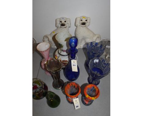 A pair of Staffordshire Whally dogs; and various coloured glassware vases including a pair of blue flashed cut glass vases an