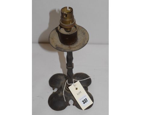 An AGI Art Deco cast metal lamp, raised on quatrefoil base.