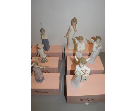 Nao figures, to include: girl with violin; angel with dove; and others, six boxed.  (7)