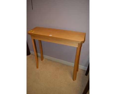 A modern rectangular console table, by Mike Mossop, with canted corners, raised on splay feet, 75cms wide.