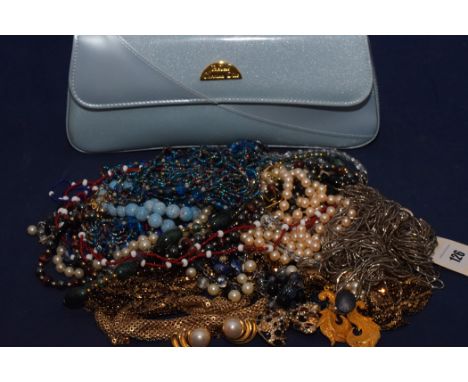 A quantity of costume necklaces and other items, in a Christian Dior case.