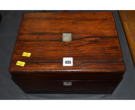 A 19th Century rosewood work box, with mother-of-pearl cartouche and escutcheon.