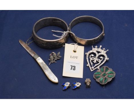 An Elizabeth II silver bangle, by N.J. Birmingham, 1972, engraved floral decoration; and another; an Edward VII silver foldin