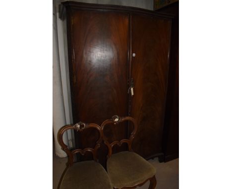 Two Victorian walnut balloon back dining chairs, the seats upholstered in green velour material, raised on cabriole legs; tog