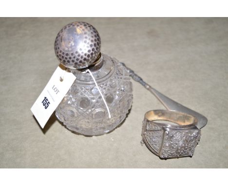 A hobnail cut glass scent bottle with silver top, London 1903; a silver bangle with ornate decoration; and a shoe-horn with s