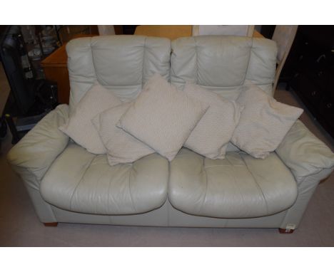 A Stressless high back two seater reclining cream leather sofa, by Ekornes.