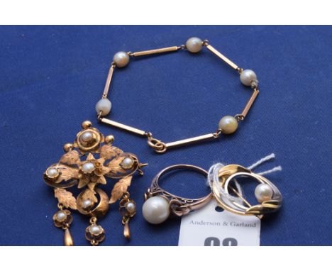 A cultured pearl brooch on 9ct. yellow gold mount; a cultured pearl ring on yellow metal mount (indistinct hallmarks), ring s