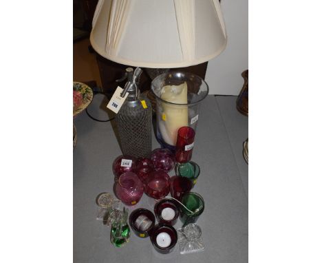 A modern glass and metal table lamp; a soda syphon; cranberry glass ware; and other items.