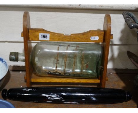     A Vintage Ship In A Bottle Within A Purpose Built Stand, Together With A Speckled Glass Rolling Pin                      