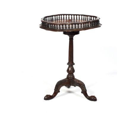 A late 19th/early 20th century Georgian style parquetry inlaid tripod table. The shaped piecrust galleried top inset with rad