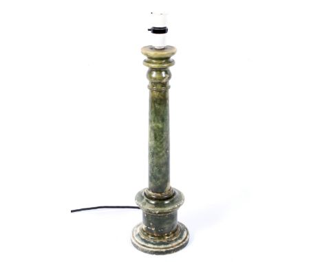 A 20th century column-shaped carved alabaster table lamp. Mottled in green tones, on pedestal base, electrified, 42.2cm high 