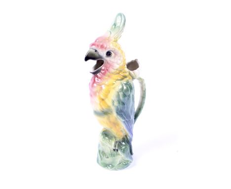 A late 19th century French (St Clement) majolica cockatoo jug. Moulded CK 8/897 and printed R marks, naturalistically modelle