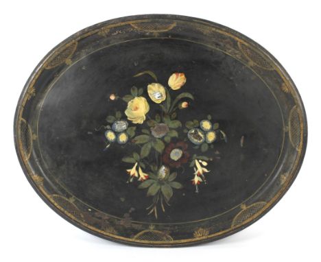 A late 19th century painted and mother of pearl tole inset oval tray. Painted with a loose flower-spray, within gilt diaper p