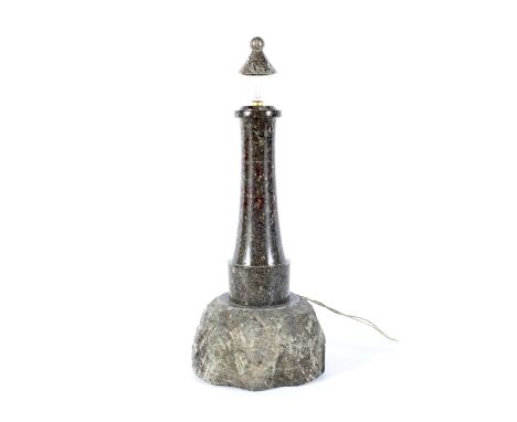 A large Cornish serpentine lighthouse shaped table lamp. The polished serpentine lighthouse on a rough rocky base, electrifie