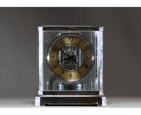 Jaeger-LeCoultre - Atmos perpetual movement clock, nickel-plated cage, gold-coloured ring dial, printed Arabic numerals. Norm