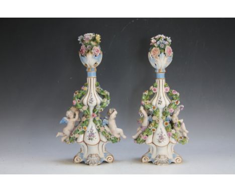 A PAIR OF MEISSEN CHERUBIC EMBELLISHED DOUBLE GOURD SHAPED FLASK / VASE AND STOPPER, with encrusted floral deciration, overal