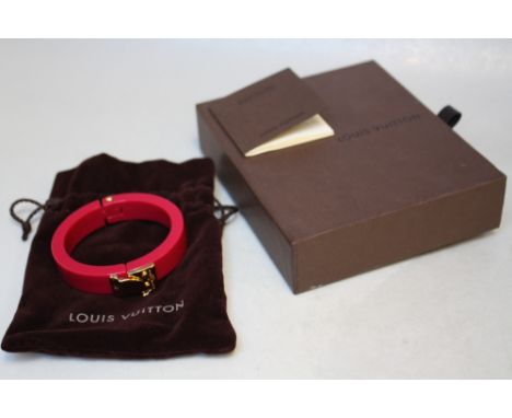 LOUIS VUITTON - A RESIN 'LOCK ME' HINGED BANGLE, with original box and Louis Vuitton drawstring bag