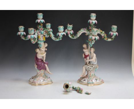 A PAIR OF MEISSEN FIGURAL FIVE BRANCH CANDELABRA, each column modelled as a seated lady holding a child, the removable five b