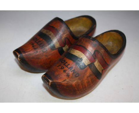 A PAIR OF VINTAGE DUTCH CLOGS DATED 'Holland 1944', decorated with the Dutch flag and coming with a hand written anecdotal no