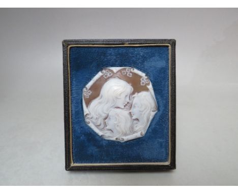 A FRAMED CARVED PORTRAIT CAMEO PLAQUE DEPICTING THE THREE GRACES, the cameo of octagonal form, in velvet mount fitted in an e