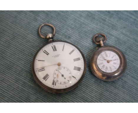 A SILVER OPEN FACED MANUAL WIND POCKET WATCH, Dia 4.5 cm together with a small silver fob watch (2) 