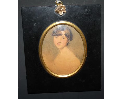 (XIX). an oval portrait miniature study of a young lady, unsigned, watercolour on paper, framed and glazed, frame with brass 